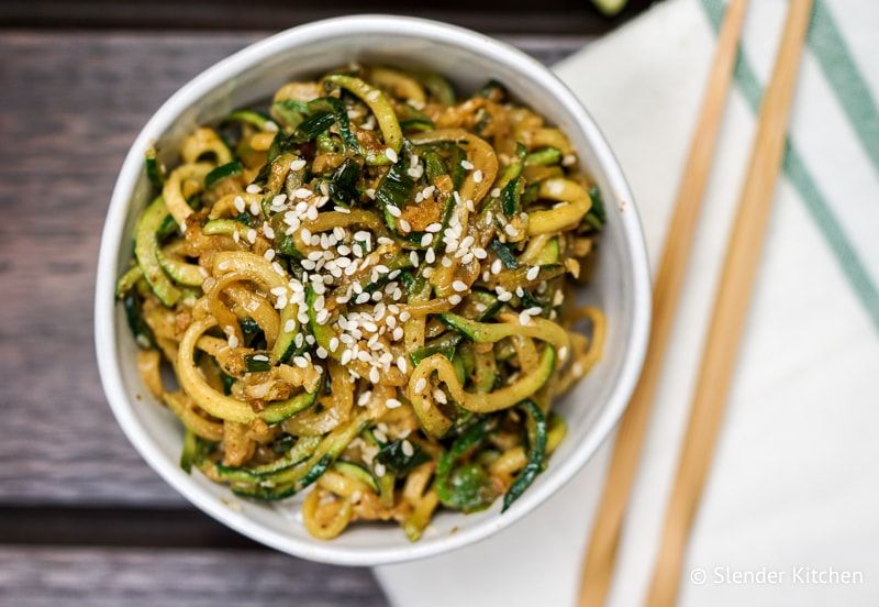 Asian Zucchini Noodles in a bowl with sesame seeds.