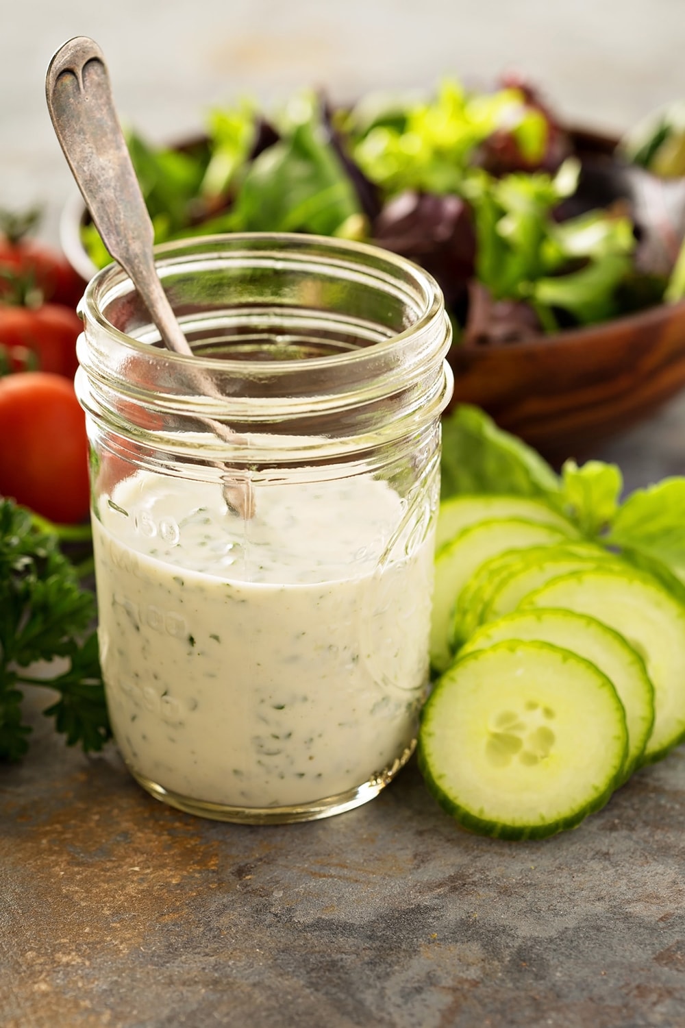 Weight Watchers Ranch Dressing in a mason jar with lettuce in the background.