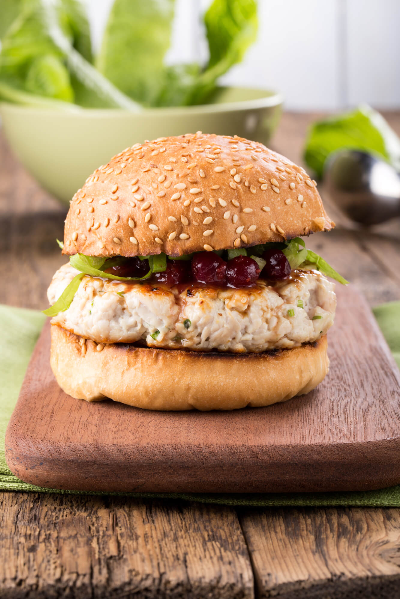 Chicken and zucchini burgers with cranberry sauce on wheat bread.