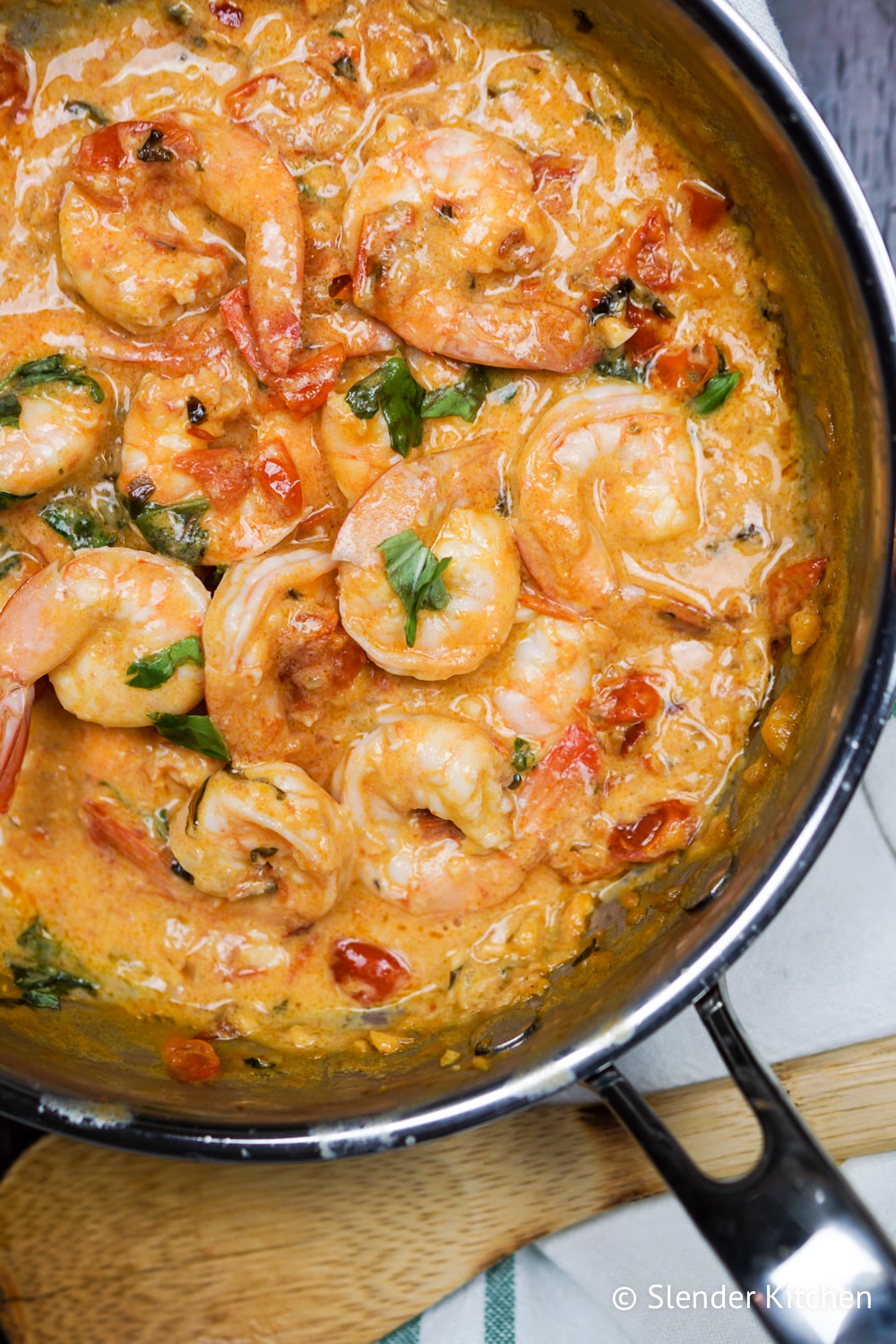 Weight Watchers Coconut Shrimp and Tomatoes in a creamy sauce in a pan.