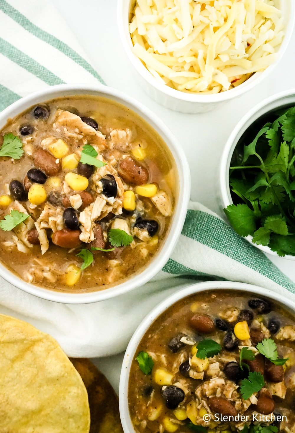 Weight Watchers Taco Soup on a white napkin with cheese and cilantro.