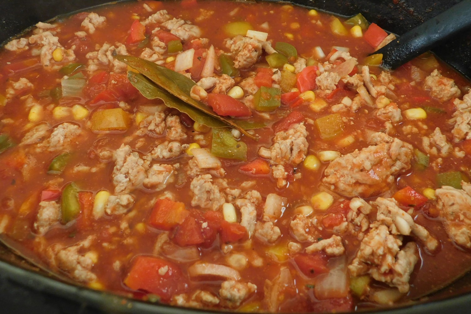 Weight Watchers Slow Cooker Chili in the crockpot with corn, chicken, and broth.