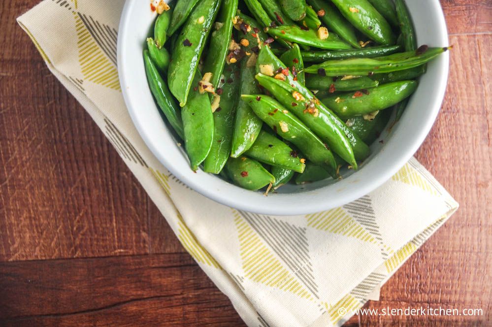 A simple low carb side dish with sugar snap peas, sesame seeds, and red pepper flakes.
