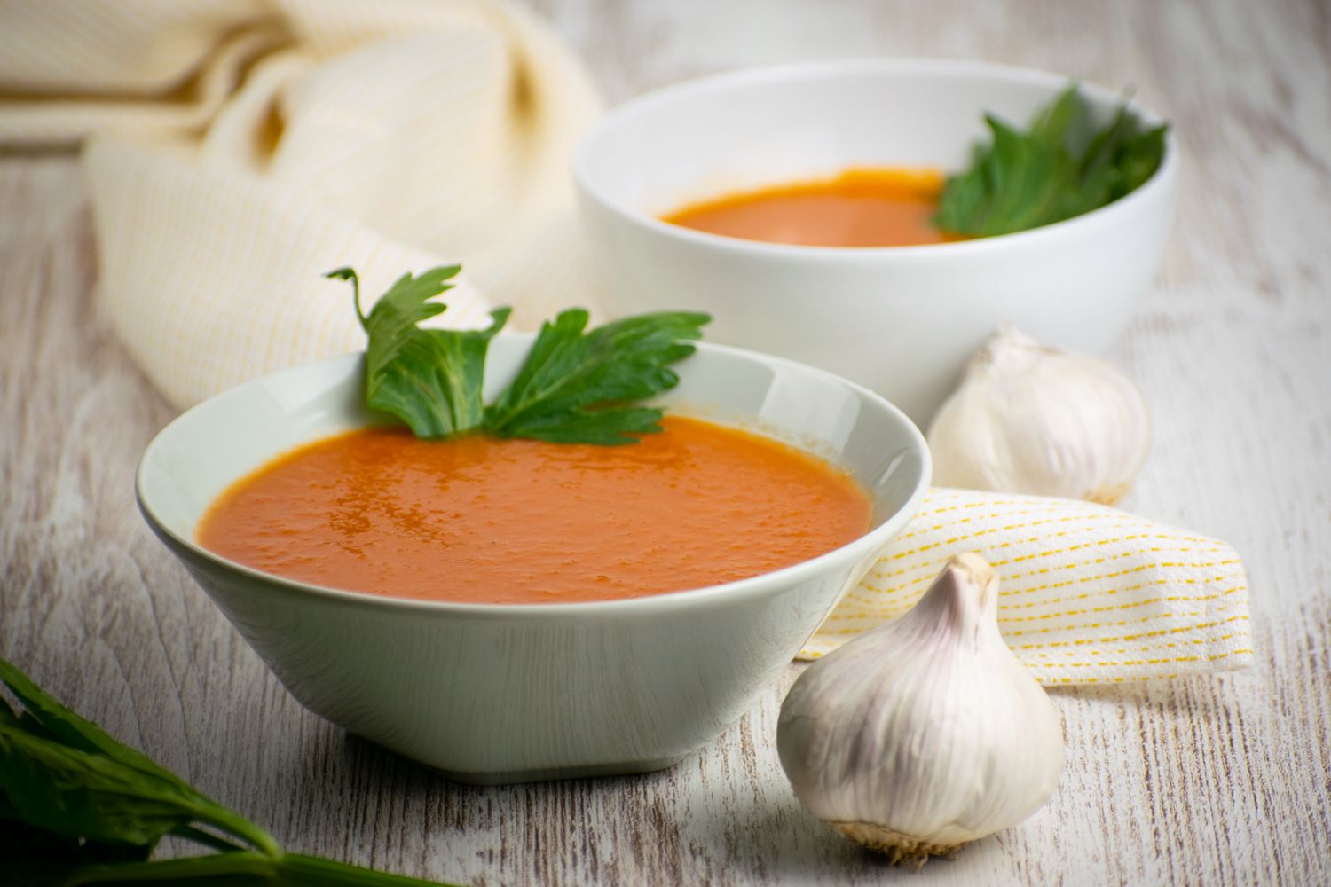 Slow cooker tomato soup with chipotle flavors in a bowl with a napkin.