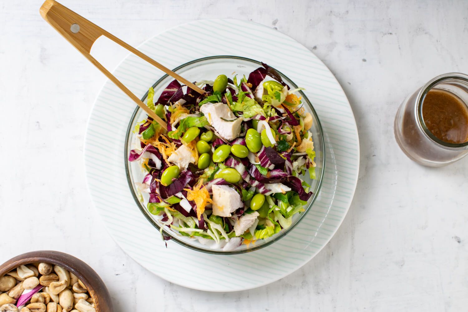 Sweet Chili Chicken Salad with cabbage, edamame, and a peanut lime dressing.