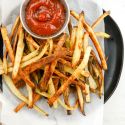Crispy turnip fries with ketchup on a plate.
