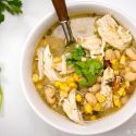 Easy White Chicken Chili with pinto beans, white beans, corn, and chicken in a green salsa broth.