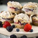 Frozen oatmeal cups piled up with berries.