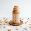 Overnight oatmeal with banana and peanut butter in a glass jar.