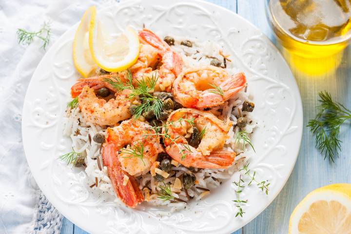 Shrimp piccata with capers and lemons over a bed of rice. 