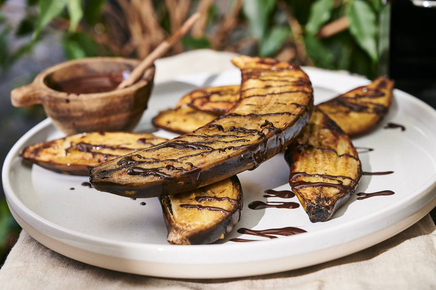 Homemade grilled bananas drizzled with chocolate and peanut butter.