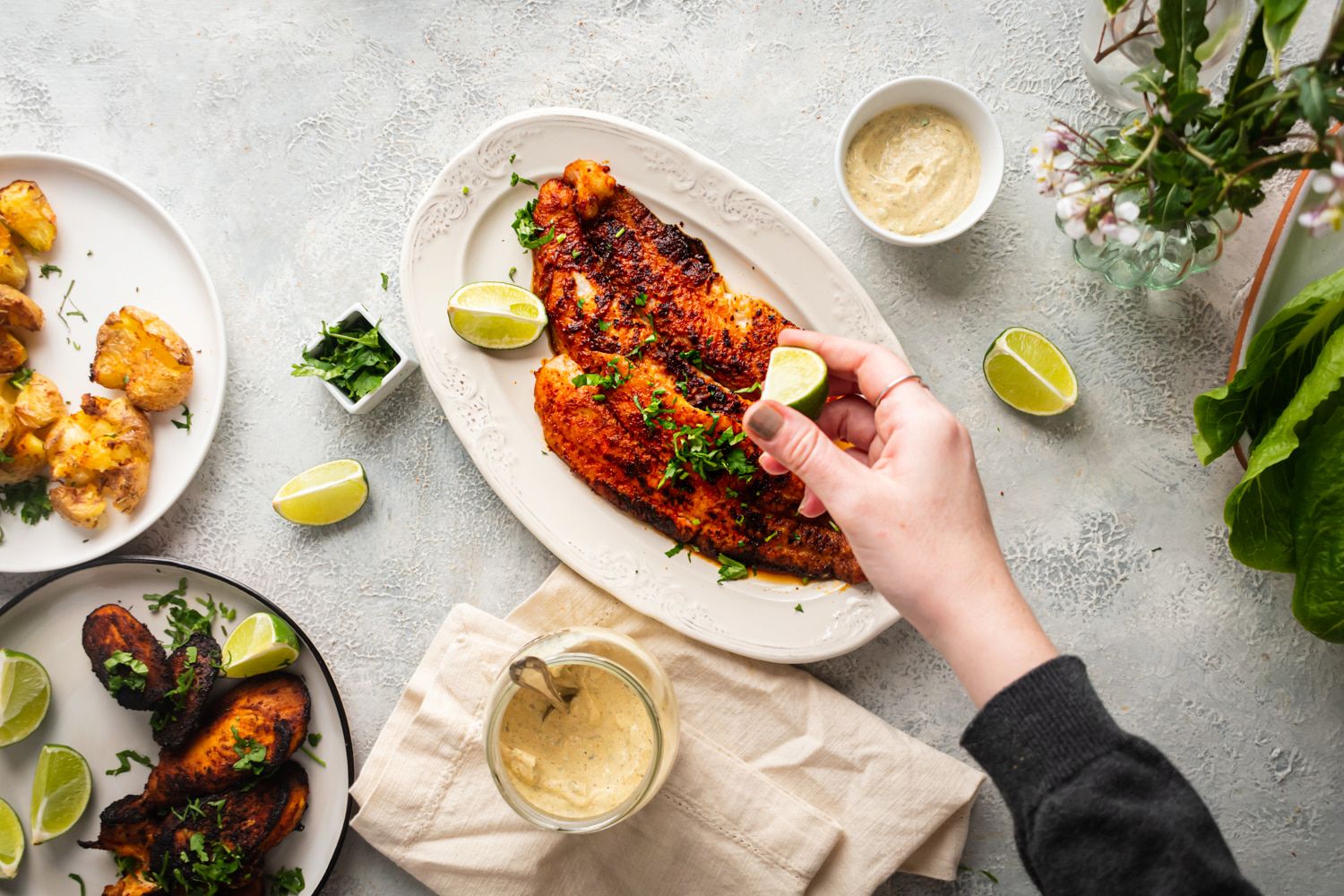 Blackened fish made with mahi mahi and served with crispy potatoes, fresh limes, and fresh parsley.