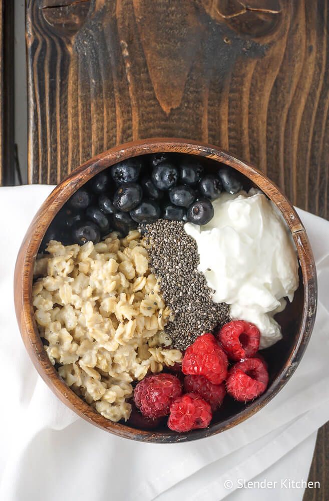 Cashew Milk Overnight Oats in a wooden bowl with chia seeds and yogurt.