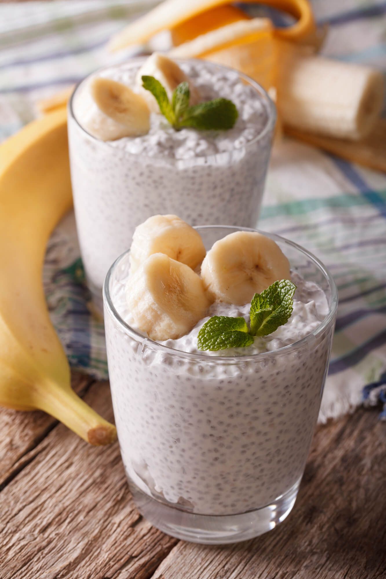 Coconut chia seed pudding in a glass with banana.