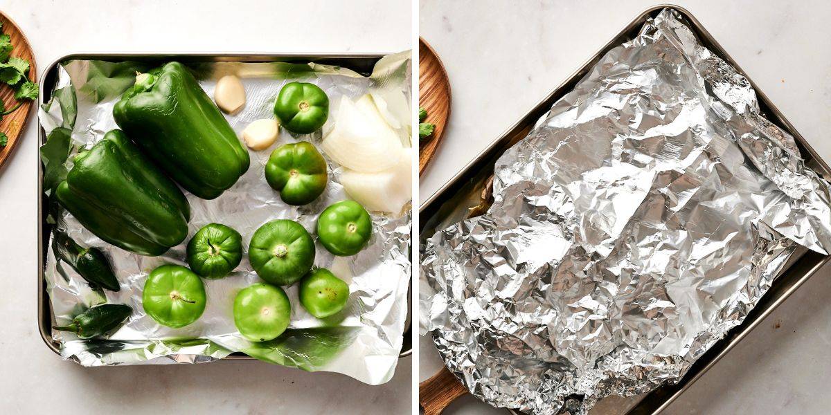 Green bell peppers, tomatillos, garlic, onions, and cilantro on a baking sheet, ready to be roasted.