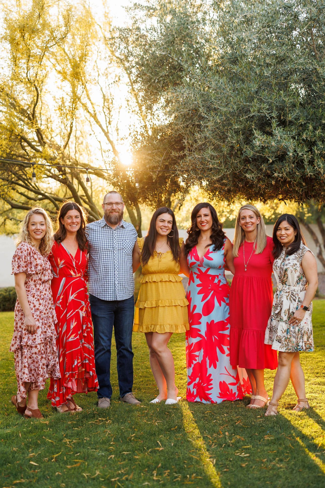 Food bloggers in front of a large tree.