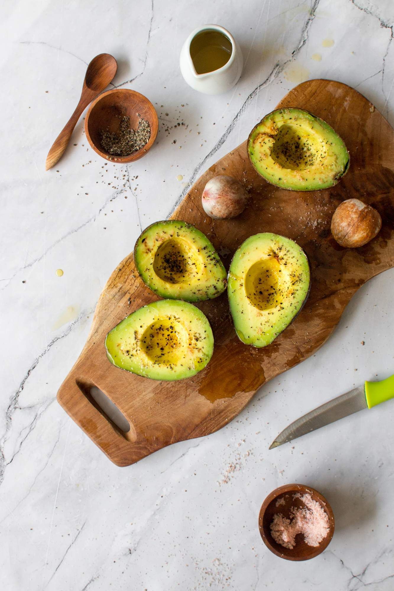 Avocados brushed with olive oil, salt, and pepper before going on the grill. 