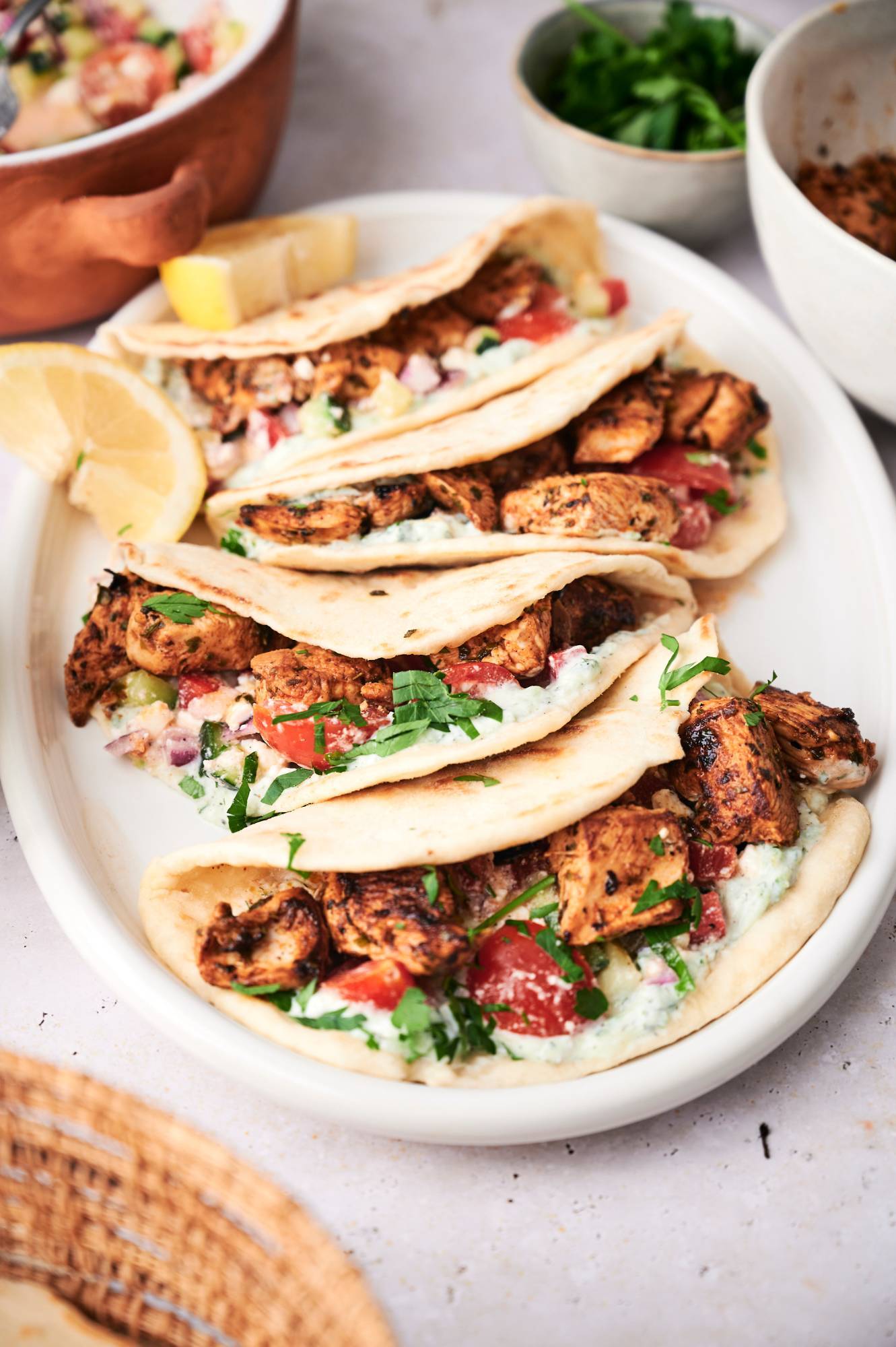Chicken tacos with Mediterranean spices served in pita bread with cucumber, tomato, and feta salsa. 