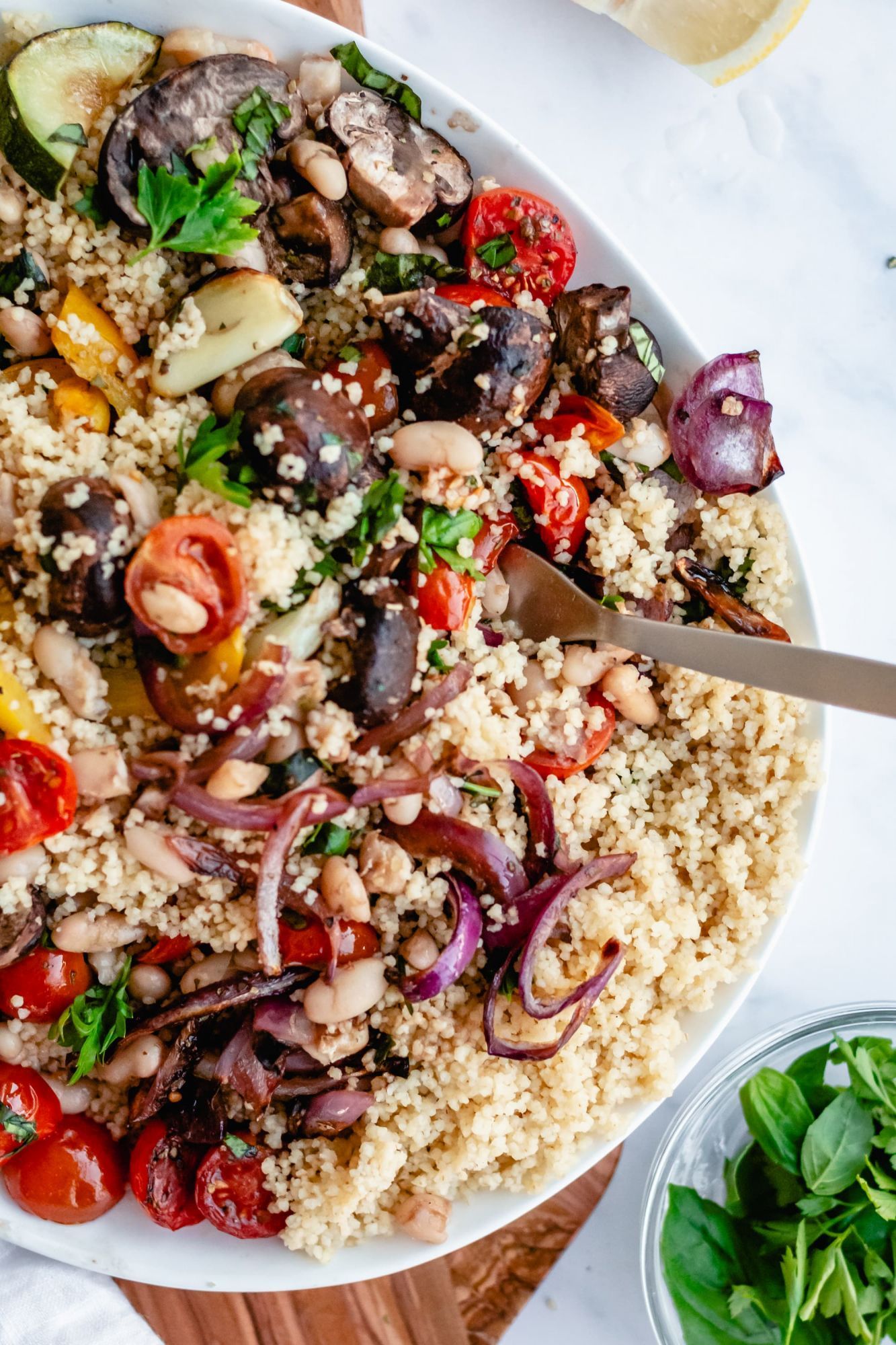 Vegetable couscous with roasted zucchini, mushrooms, tomatoes, peppers, and onions tossed with lemon and fresh herbs.