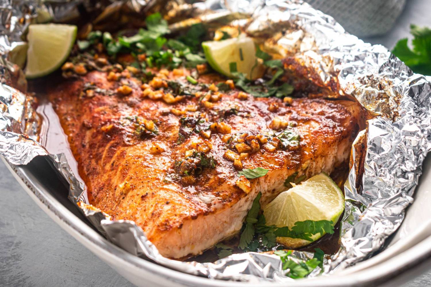 Salmon cooked in a foil packet with garlic, lime, and cilantro.