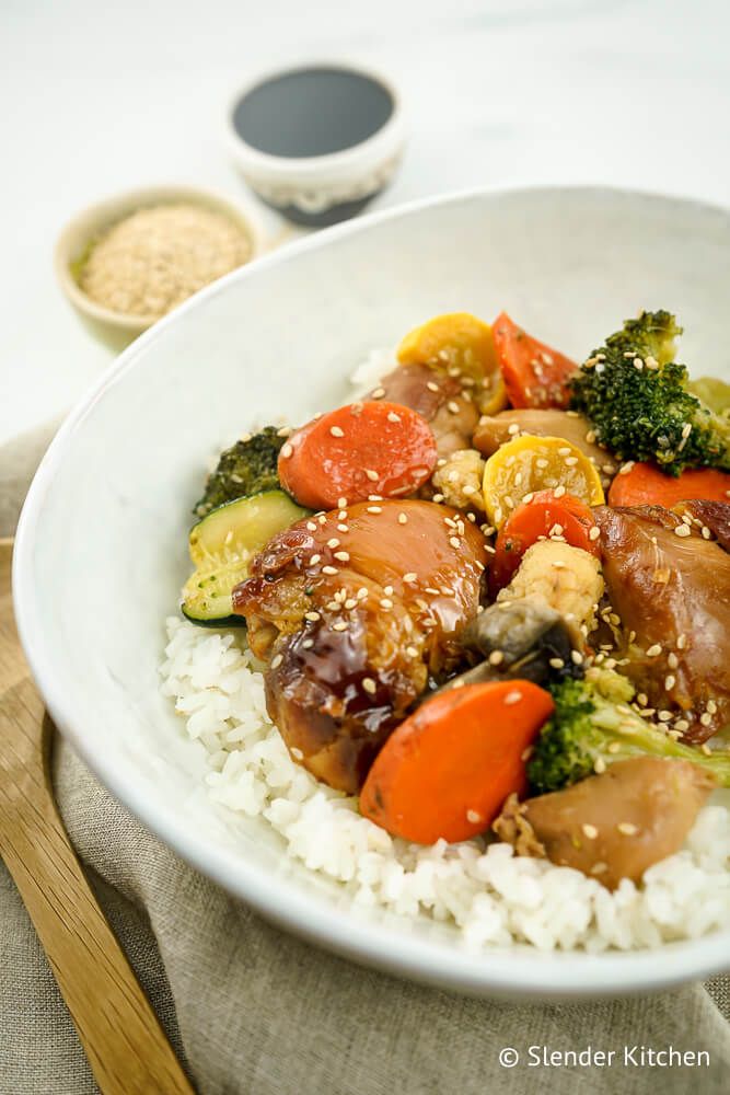 Slow Cooker Teriyaki Chicken on a plate with vegetables and rice.