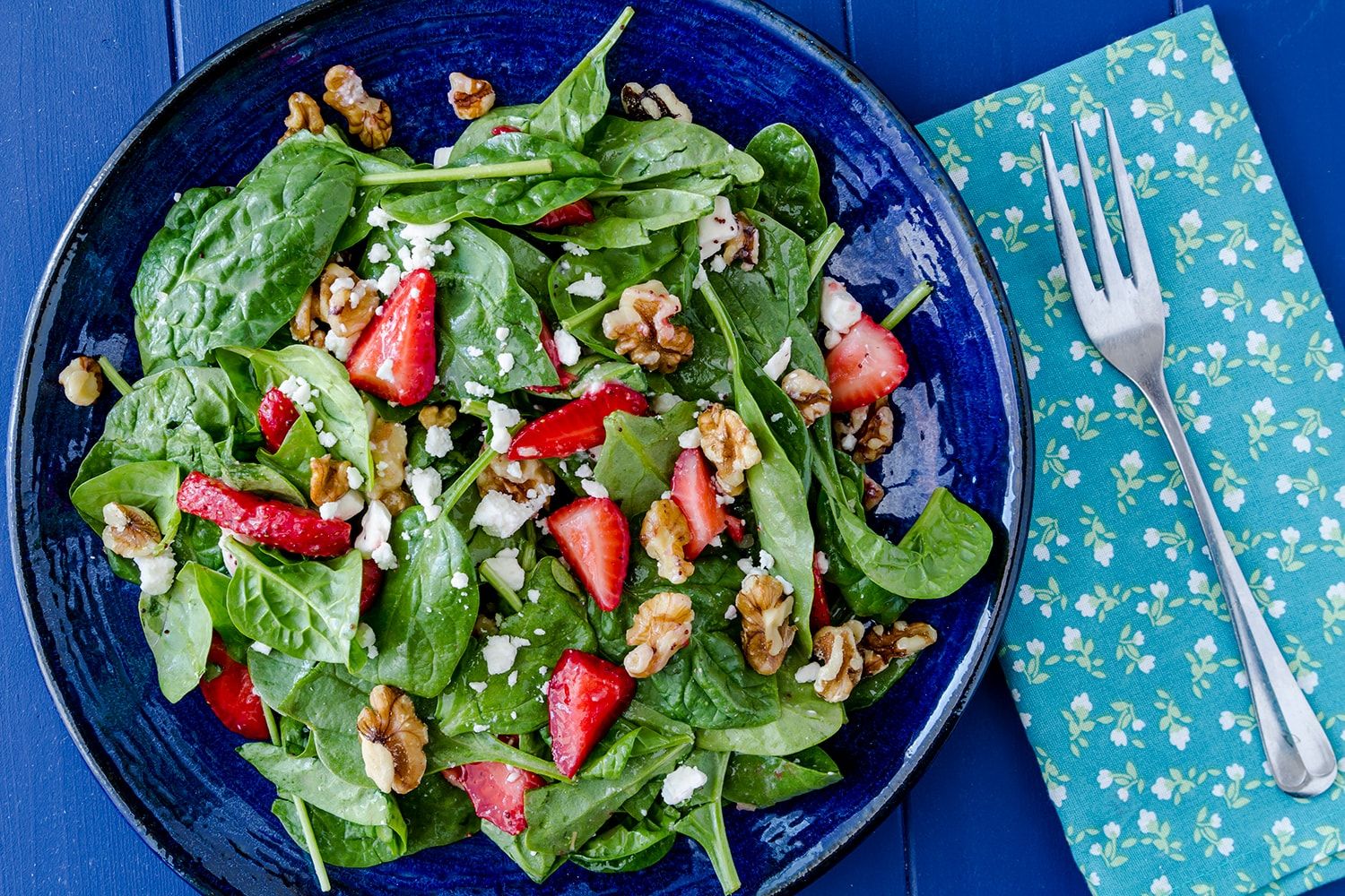 Spinach Strawberry Salad with walnuts and feta cheese and a homemade poppy seed dressing.