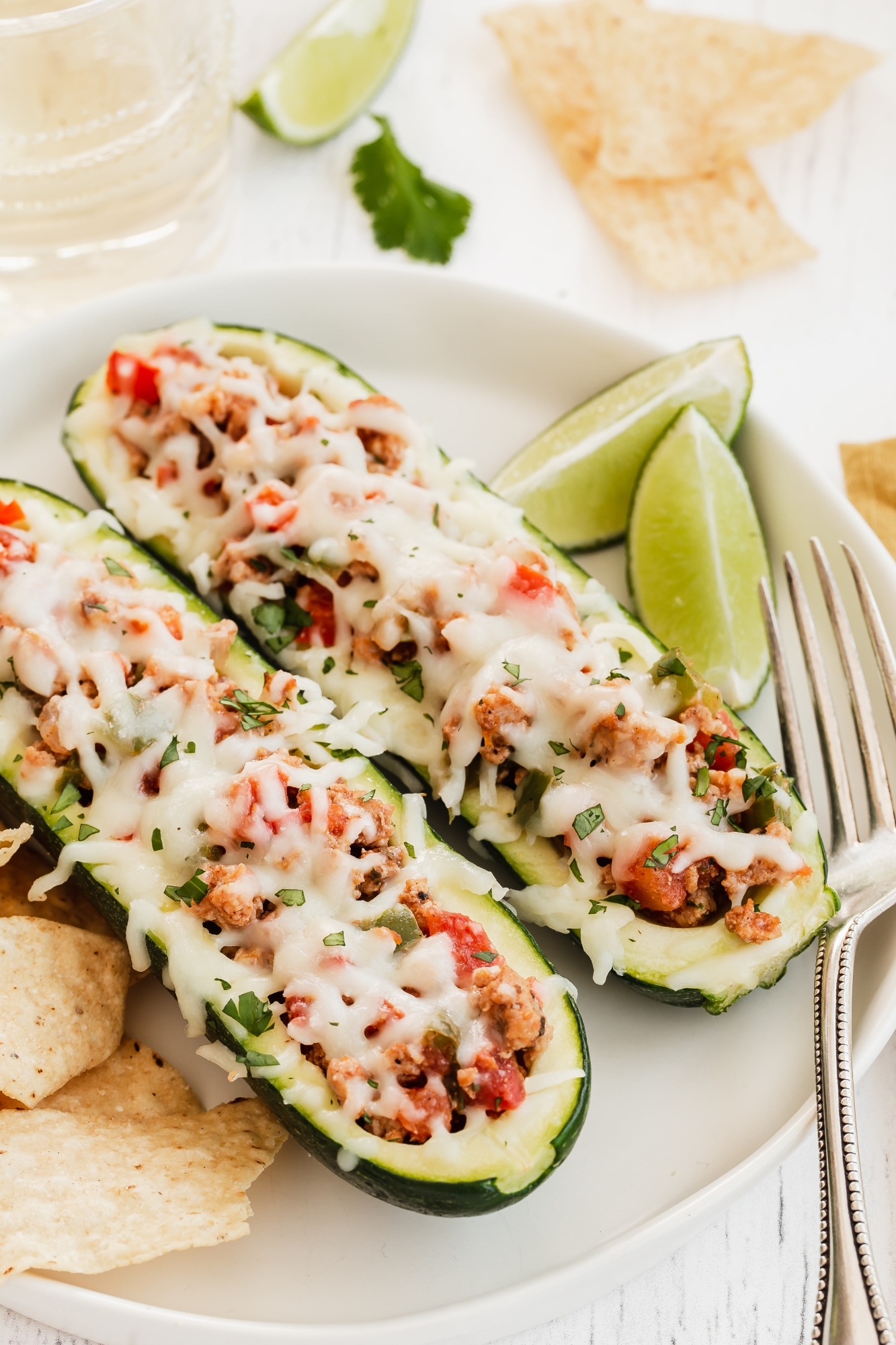 Zucchini stuffed taco boats with ground turkey, salsa, taco seasoning, and melted cheese.