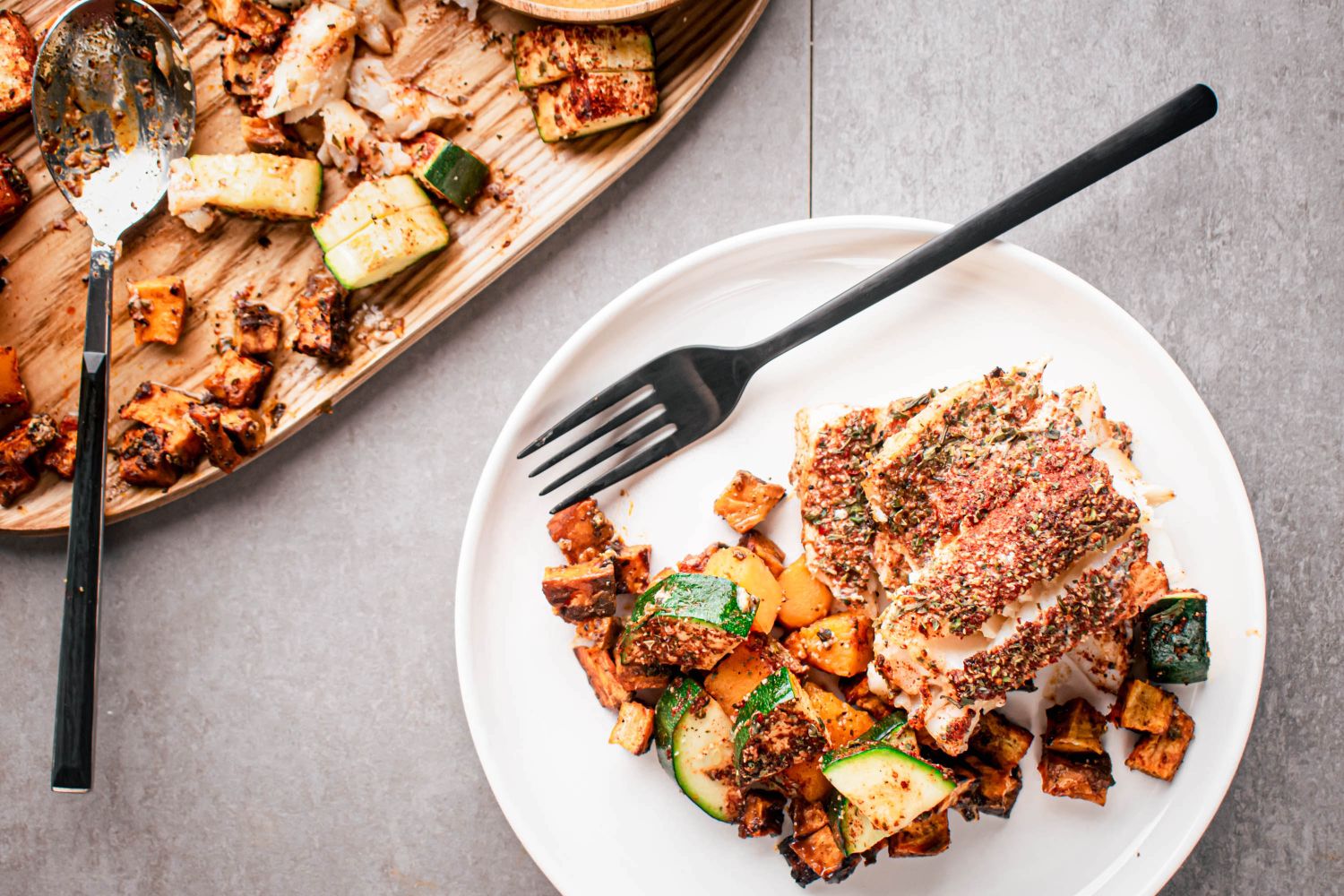 An easy and healthy sheet pan recipe with cod, sweet potatoes, and veggies.