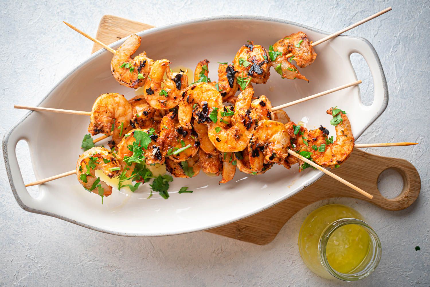 Grilled garlic shrimp on skewers with fresh lemon