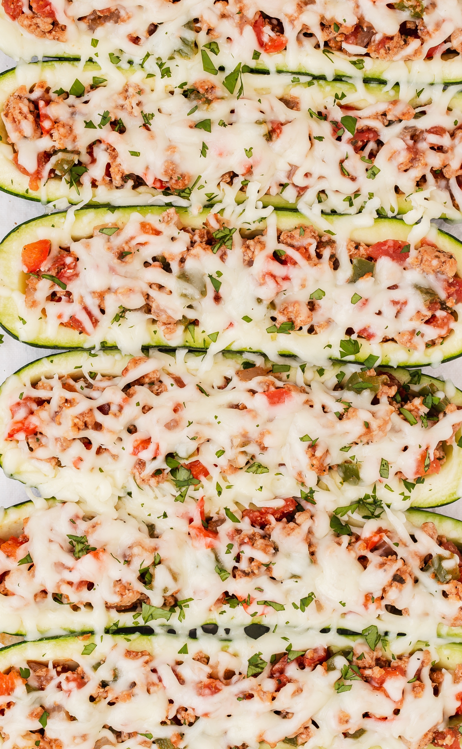 Taco zucchini boats with ground turkey, chunky salsa, and melted cheese.