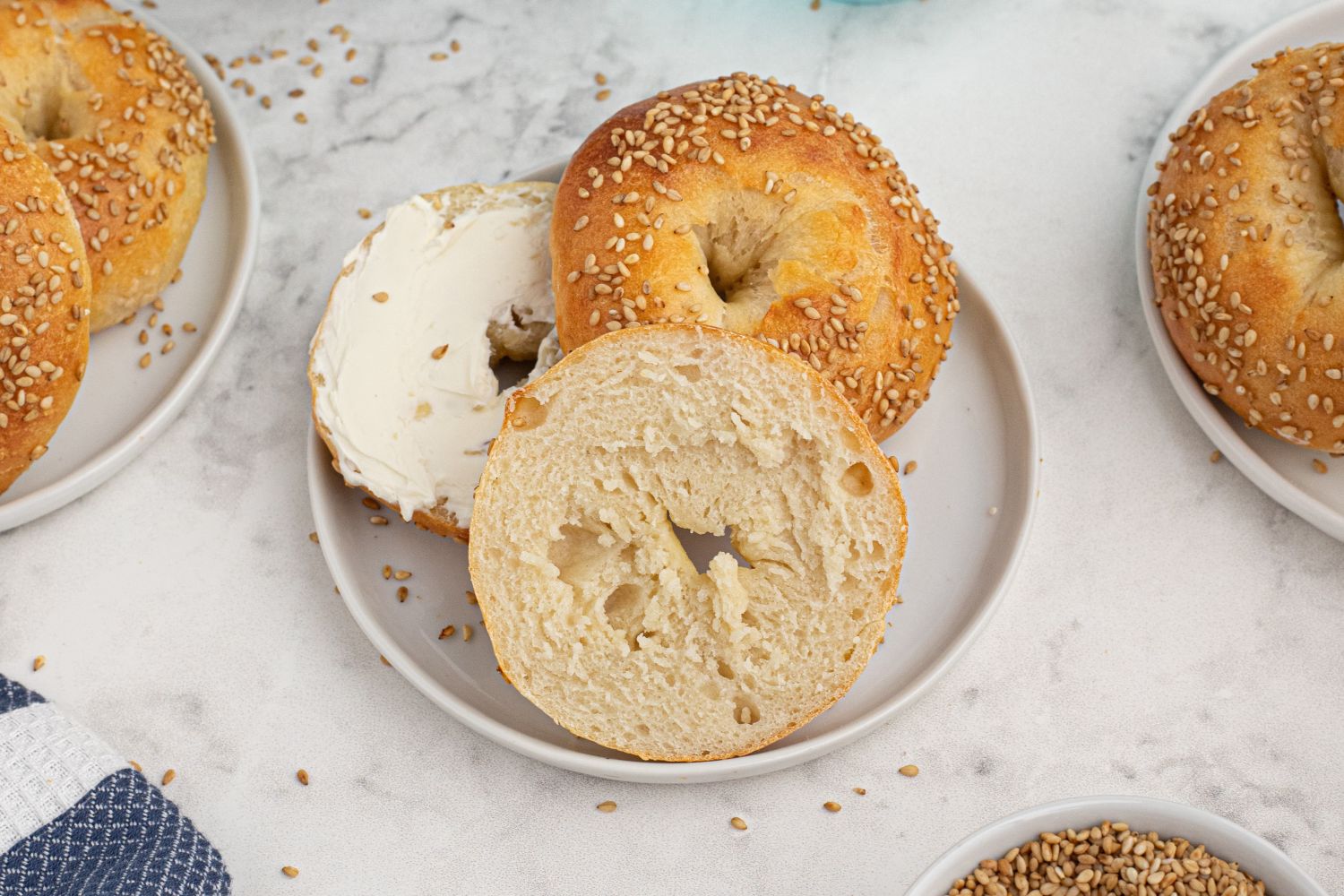 Two ingredient dough bagels with sesame seeds and served with cream cheese.