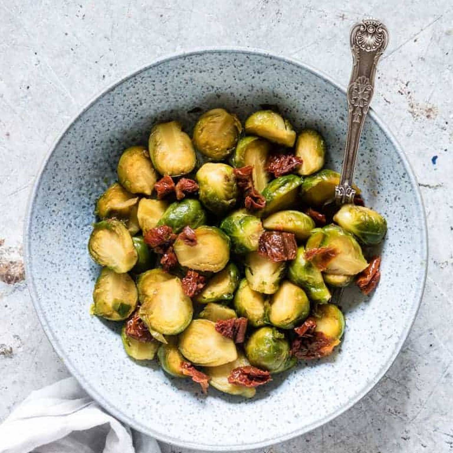 Instant Pot Brussels Sprouts with bacon served in a bowl.
