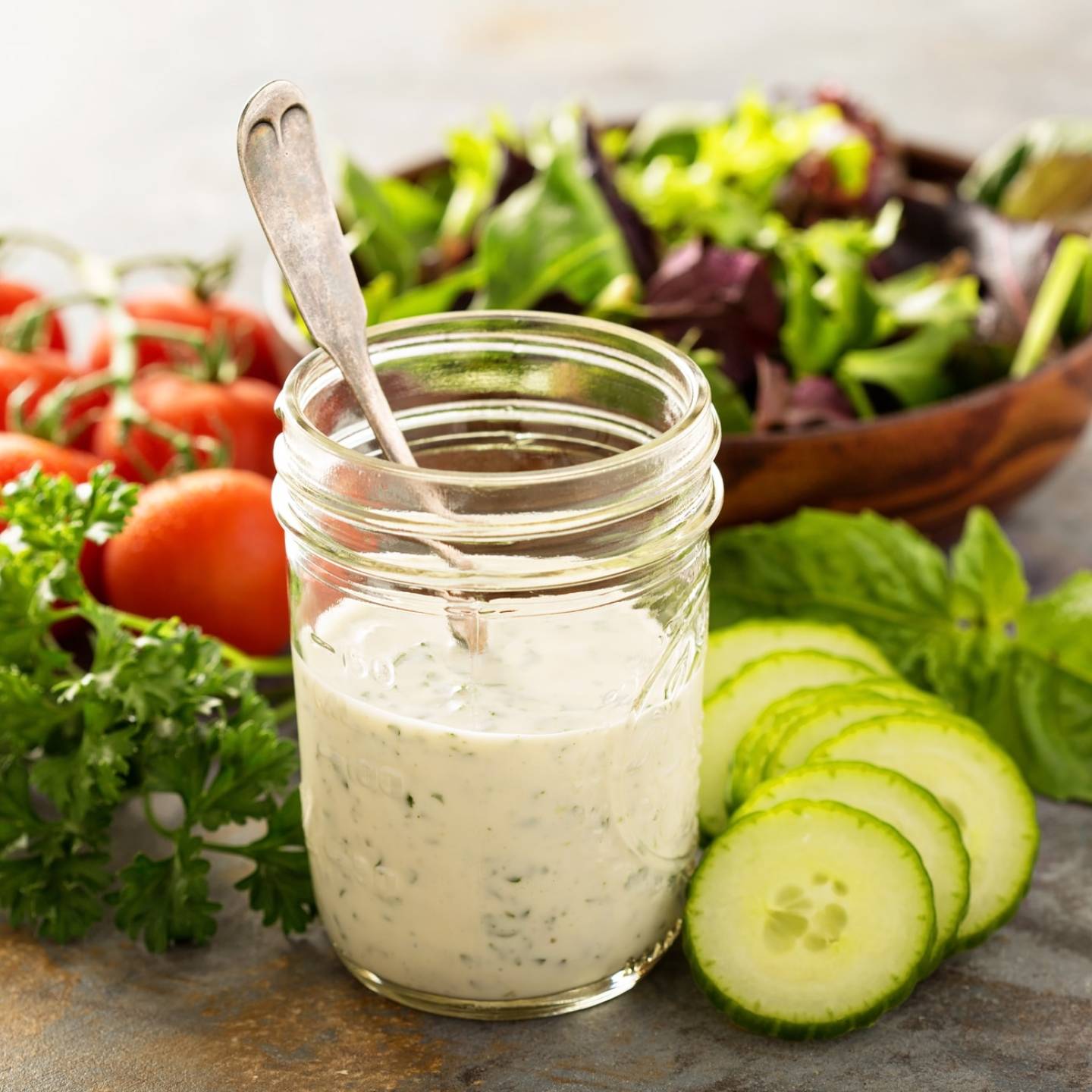 Skinny ranch dressing in a glass mason jar with vegetables.