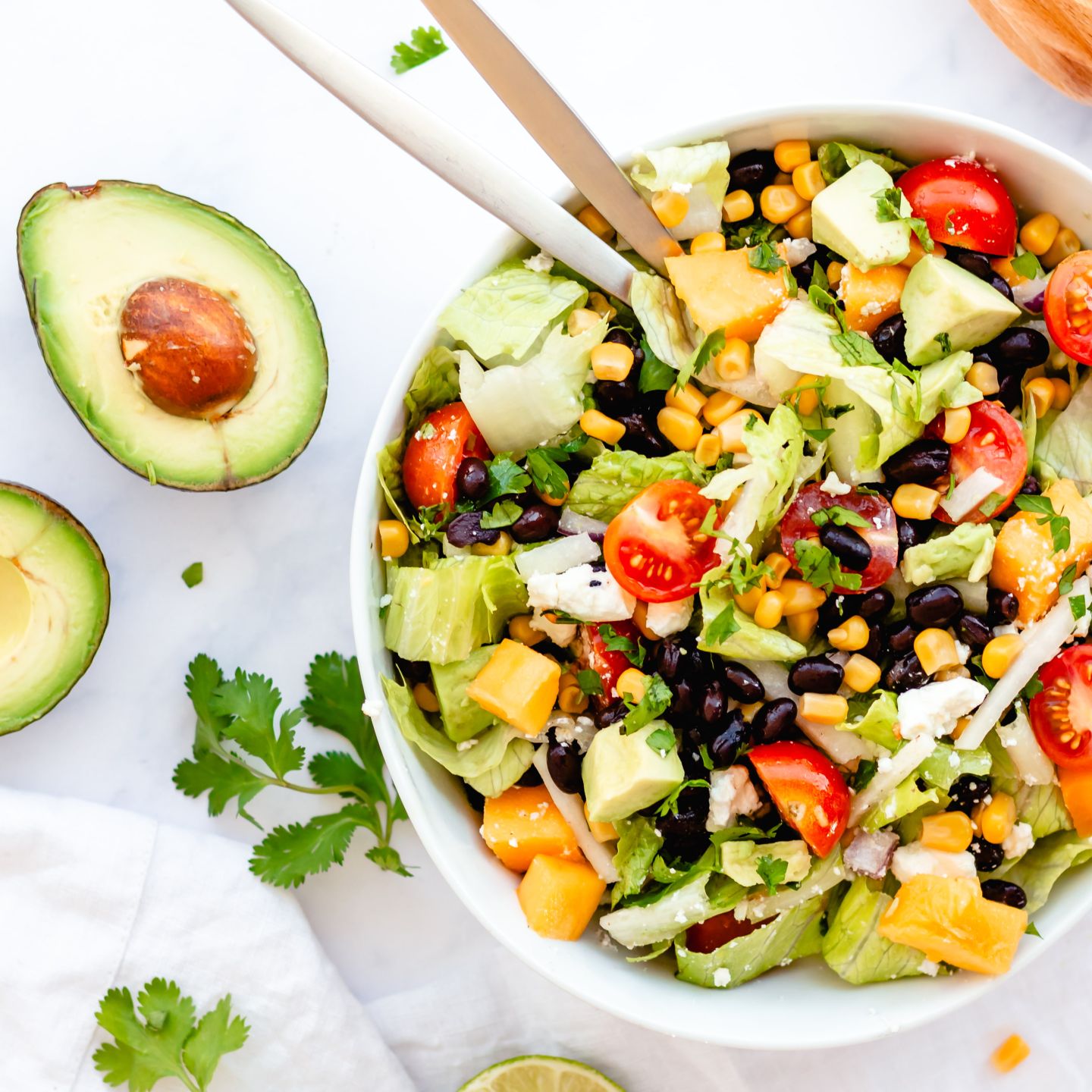 Mexican chopped salad with black beans, corn, avocado, and Mexican dressing.