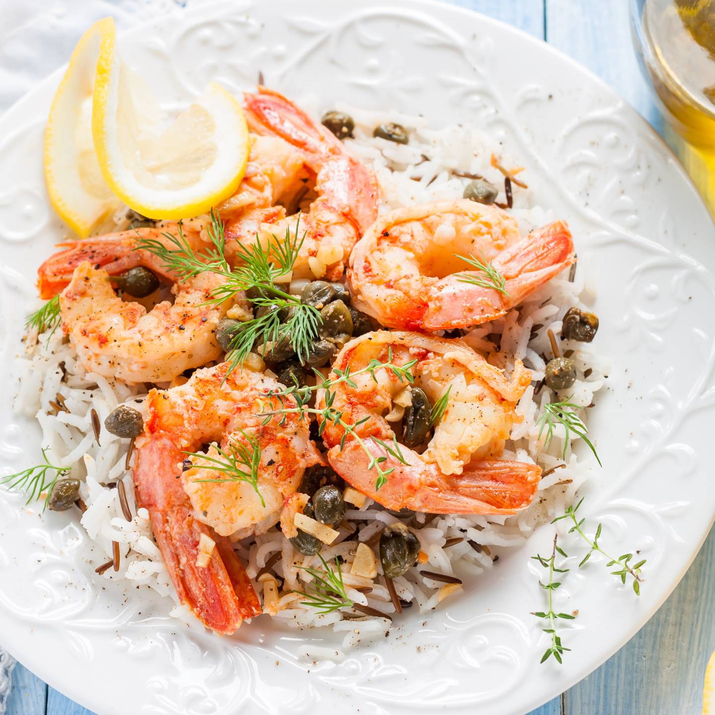Shrimp piccata with capers and lemons over a bed of rice. 