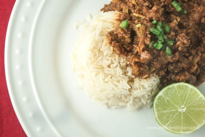 Thai curry ground beef with red curry pasta and coconut milk served over a bed of white rice.