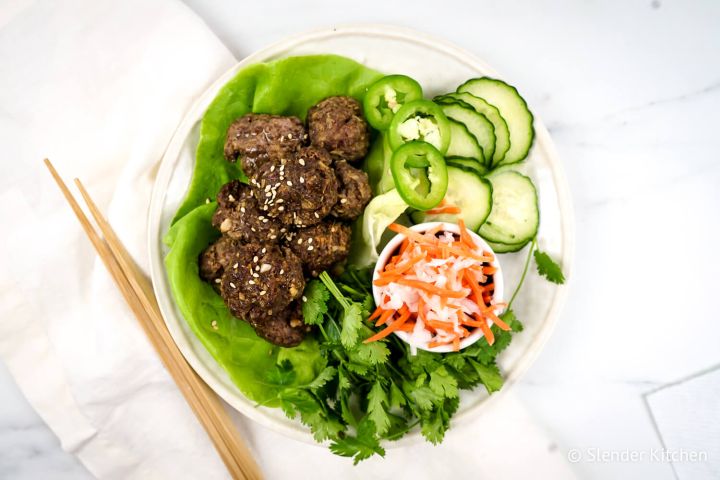 Asian meatballs with cucumbers, pickled carrots, and lettuce wraps.