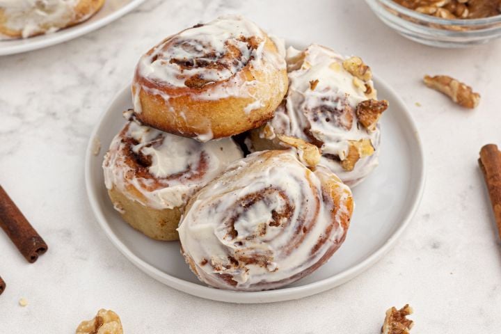 Easy cinnamon rolls made with two ingredient dough and topped with cream cheese glaze and cinnamon.