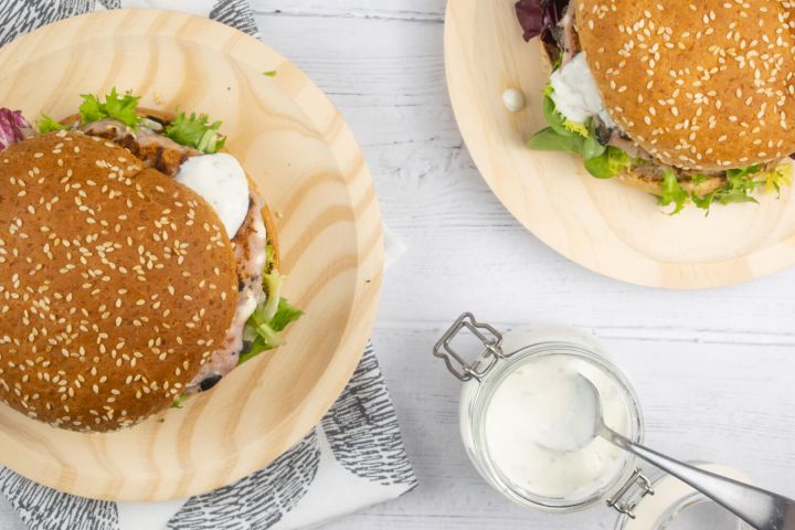 Greek Turkey Burgers with black olives and feta on a whole wheat burger bun.