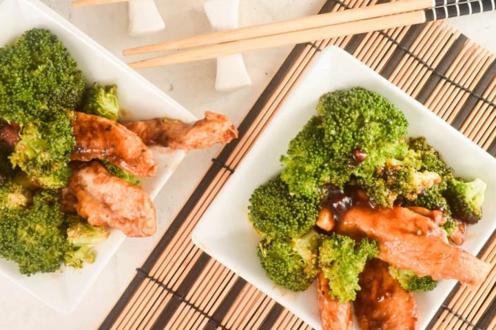 General Tso's Chicken and Broccoli in two bowls with chopsticks.