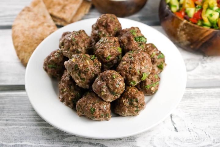 Greek meatballs or Keftedes with cucumber salad and tzatziki.