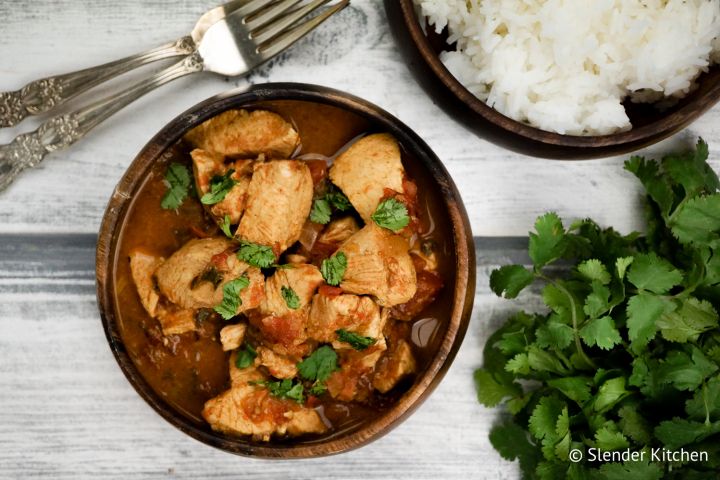 Instant Pot Chicken Tikka Masala in a creamy curry coconut milk with fresh cilantro and chicken breast.