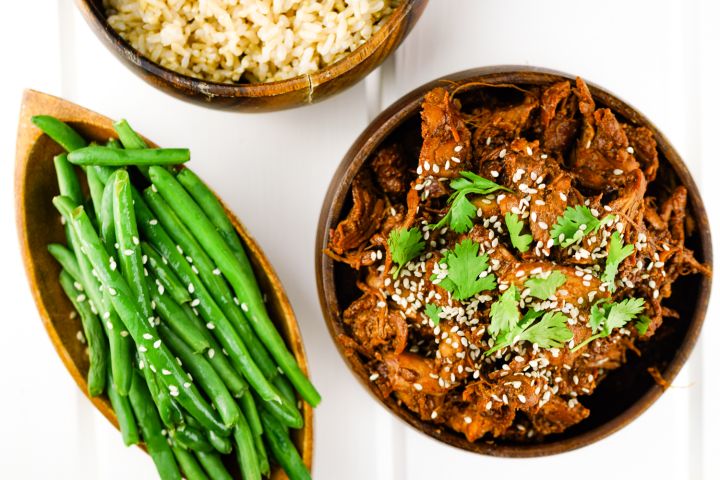 Instant Pot Honey Garlic Chicken on a bed of rice with green beans.