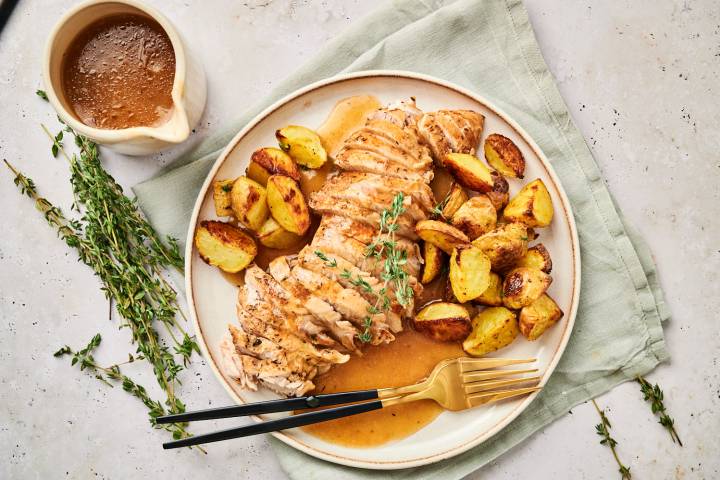 Instant Pot turkey tenderloin with roasted potatoes and fresh thyme.