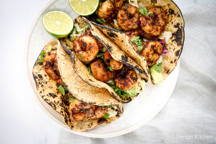 Low carb shrimp tacos with cabbage slaw and avocado.