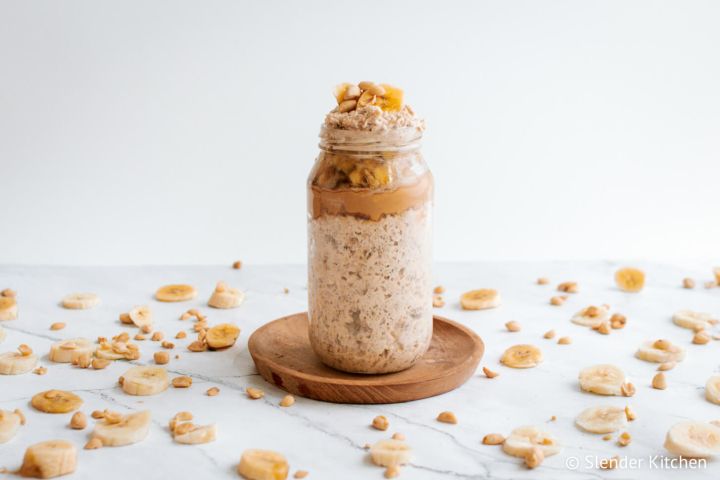 Overnight oatmeal with banana and peanut butter in a glass jar.