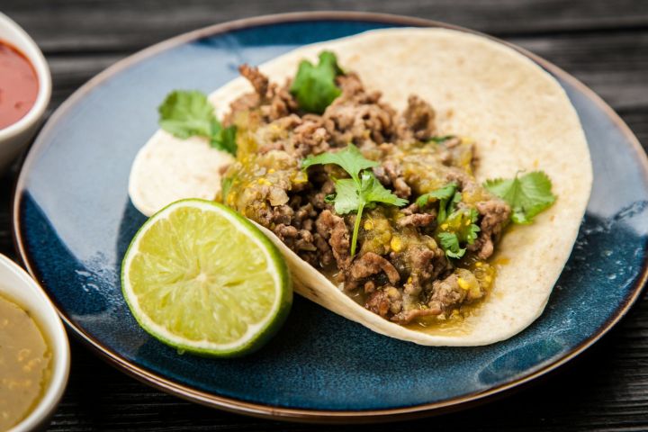 Ground turkey tacos with salsa verde in yellow corn tortillas.