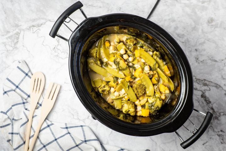 Slow cooker Curry Chickpeas with Vegetables in a black crockpot.