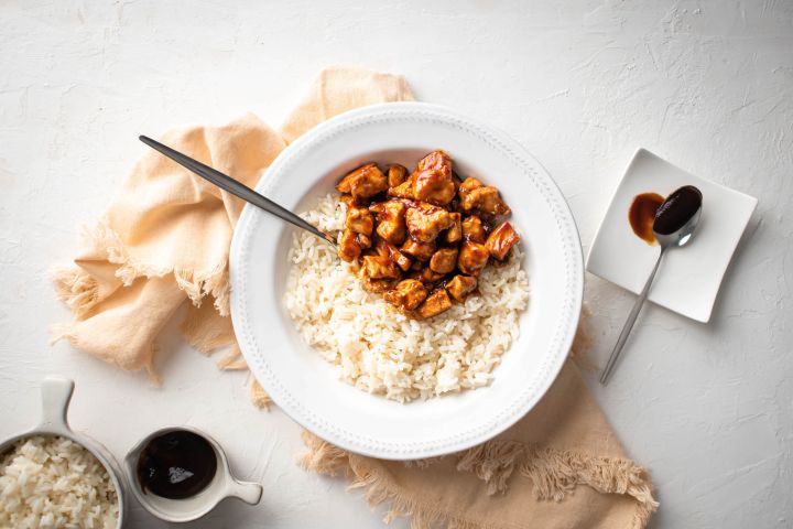 Spicy skillet hoisin chicken with chicken breast covered in hoisin sauce and served with rice.