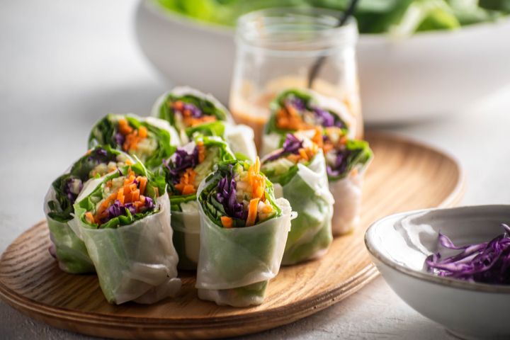 Fresh spring roll with tofu, cold noodles, and vegetables with peanut sauce.